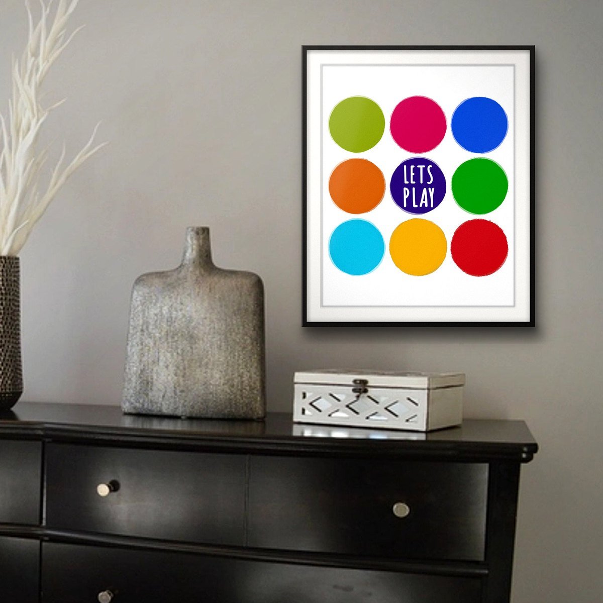 Let's Play shown framed on a wall