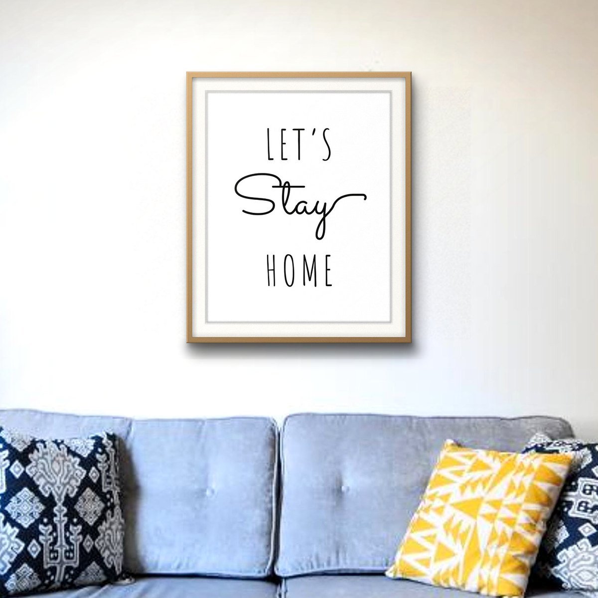 Let's Stay Home shown framed on a wall