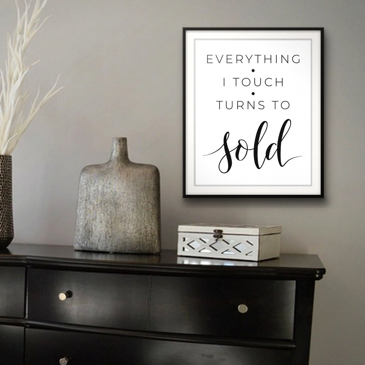 Everything I Touch Turns To Sold shown framed on a wall