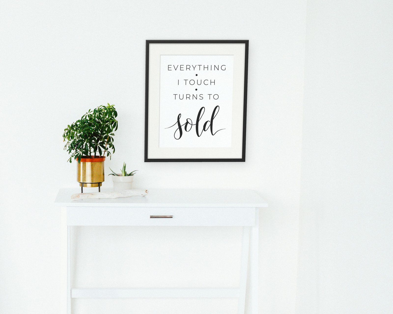 Everything I Touch Turns To Sold, Framed in a hallway and entry