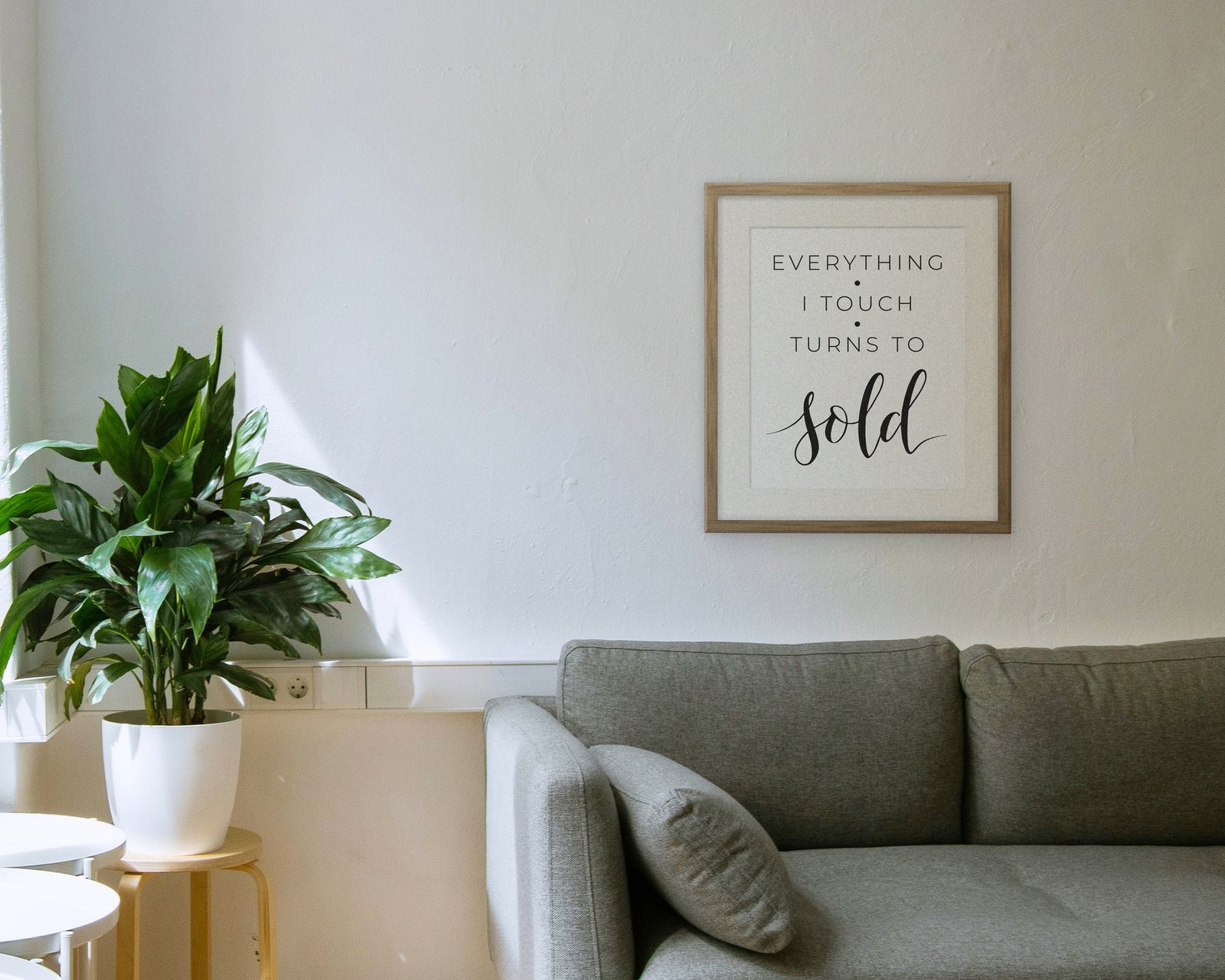Everything I Touch Turns To Sold, Framed in a living room
