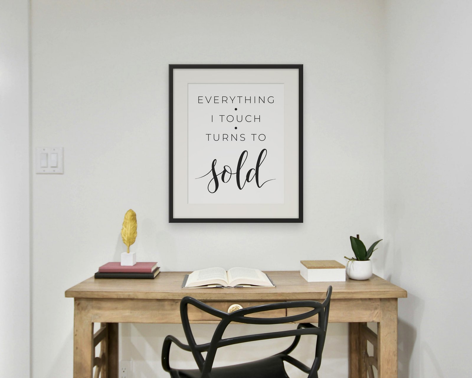 Everything I Touch Turns To Sold, Framed in a home office